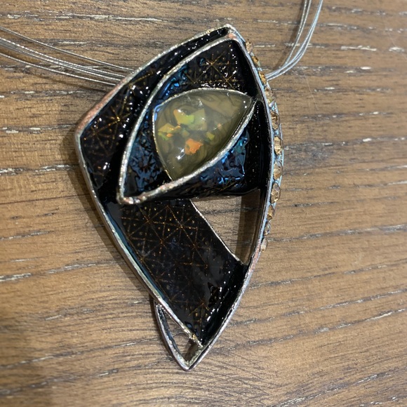 Metal pendant. Geometric pattern under dark amber enamel. Retro design on wire - Picture 3 of 6